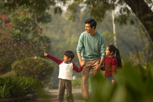 Father with children enjoying in park