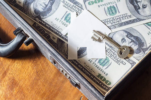 istock House and money in briefcase 185723442