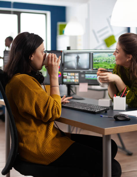 istock Team of videographers taking work break discussing and laughing 1857236729