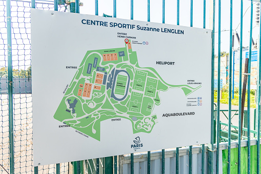 Issy-les-Moulineaux, France - September 09, 2023 : Suzanne Lenglen sports center map at the entrance portal of the park