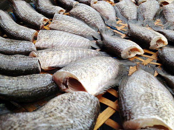 drying snakeskin gourami fishes in local market, Thailand,Photo captured with an iPhone.