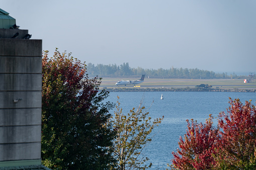 Airport over Lake Ontario from Toronto , Ontario, Canada on a bright Autumn day with a cloudless sky.