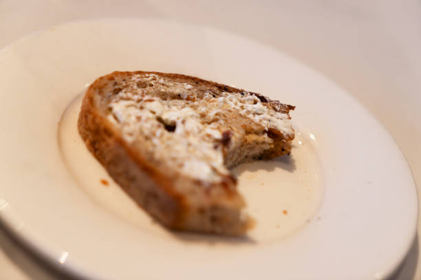 Half eaten slice of wholemeal bread