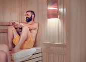 Man enjoying in spa sauna