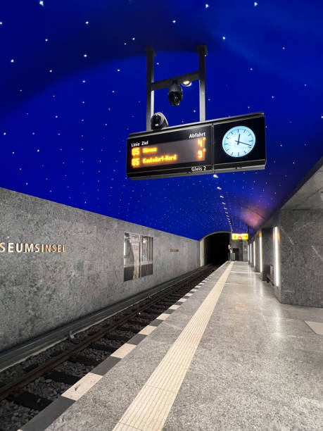 Empty subway station on Berlin's underground line U5 with digital arrival departure board The station Museumsinsel on Berlin’s underground line U5, illuminated and beautifully designed with starry sky blue ceiling, digital arrival departure board hanging above the platform digital underground stock pictures, royalty-free photos & images