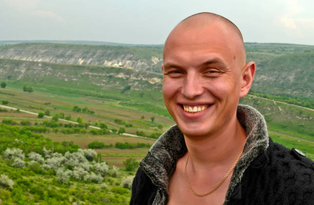 A handsome young man travels through the wine country of Moldova.