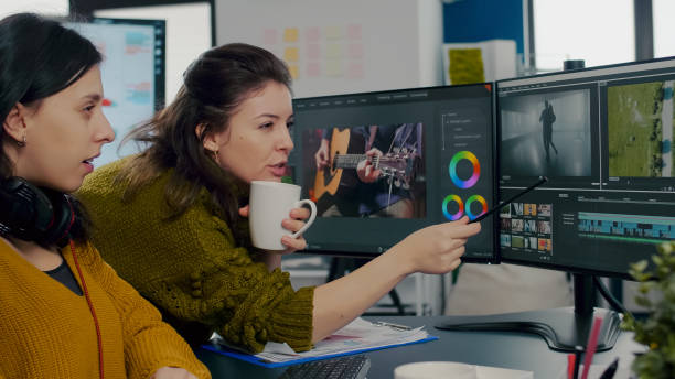 istock Coworkers video editors discussing in front of pc working for client footage 1857263128