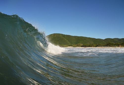 Small wave hitting the shore.