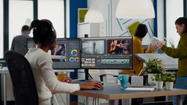 istock Black videographer putting on headset editing movie 1857268494