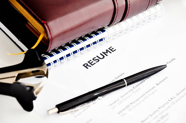 istock Professional Resume with pen resting on it 185727763