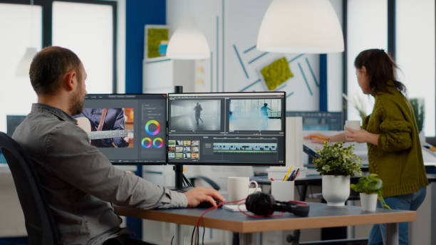 istock Videographer edits video project and cuts footage and sound 1857279811