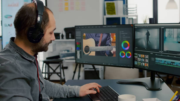 istock Videographer editing, cuting footage and sound on computer 1857280326