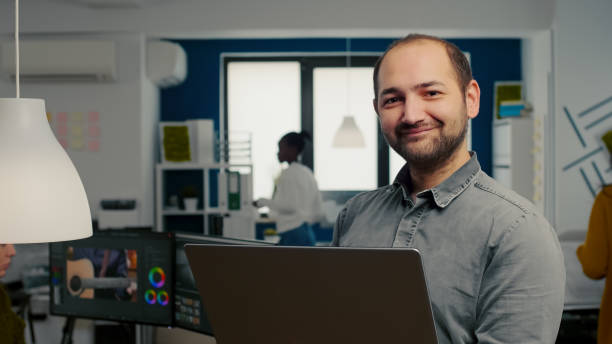 istock Video editor worker standing in front of camera smiling 1857281399