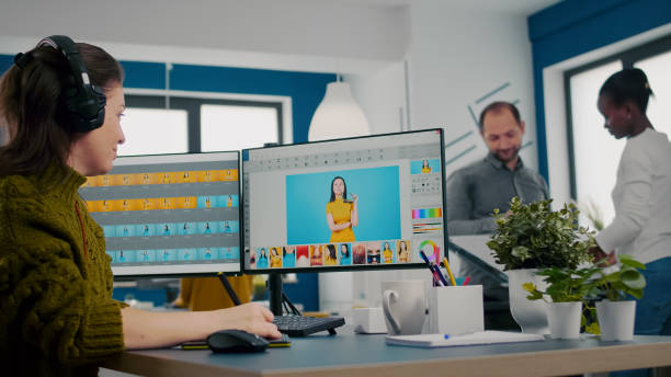 istock Retoucher putting on headset working on project drawing with stylus pencil 1857287289