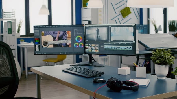 istock Modern creative workplace with nobody in and dual displays setup 1857295289