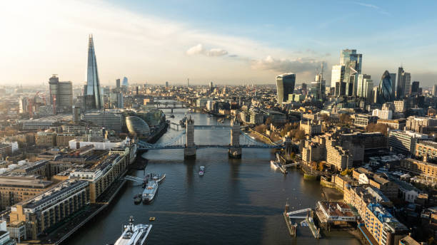 Aerial view of London and the Tower Bridge Aerial view of Tower bridge, Business Center and City of London on a sunny day. During sunset london england stock pictures, royalty-free photos & images