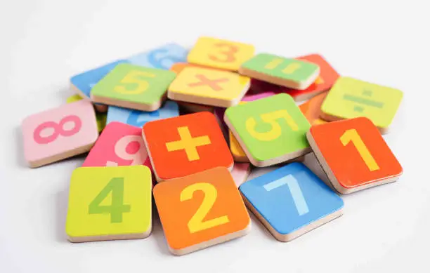 Photo of Number wood block cubes for learning Mathematic, education math concept.