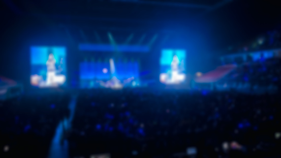 Background image with defocused blurred stage blue lights