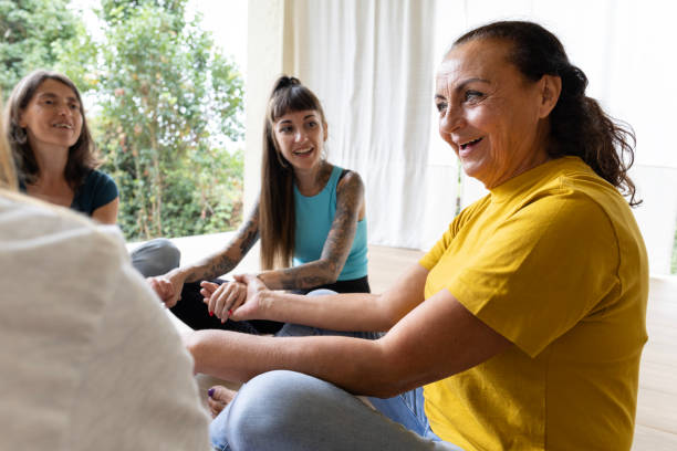 istock Woman sharing her experiences during a multigenerational group therapy session 1857327385