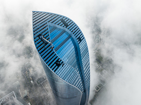 China, Jiangsu, Suzhou Industrial Park, taking aerial photos of Suzhou International Financial Center on the advection fog