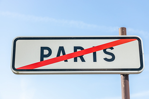 Paris, France - September 09, 2023 : Paris exit road sign at the limit of the city