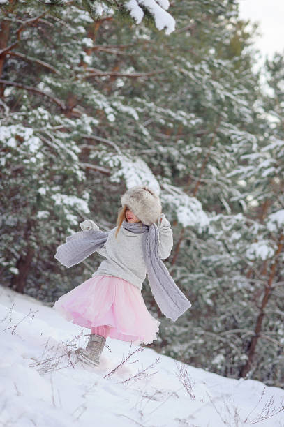 istock Happy child enjoys first snow. Close up and copy space 1857348247
