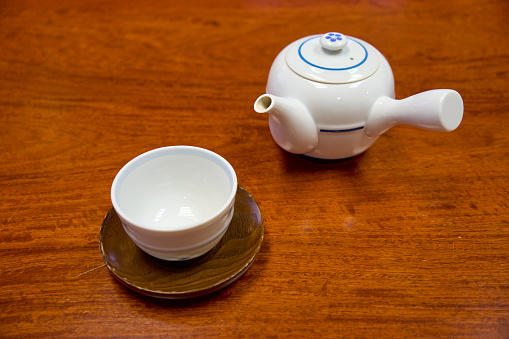 Japanese teacup and teapot on the table