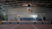 Gymnast woman practicing on balance beam