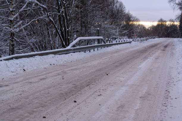 istock Snowy road with safety railing in metal 1857363469
