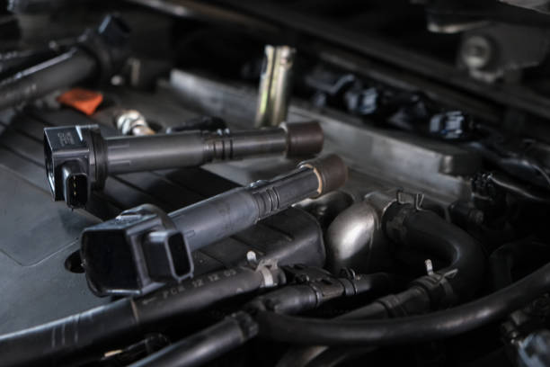 istock Mechanic man hand repair ignition on car engine 1857371206