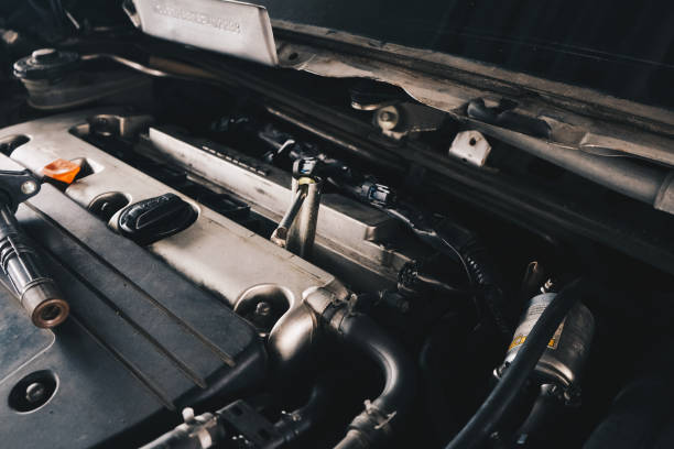 istock Mechanic man hand repair ignition on car engine 1857387272