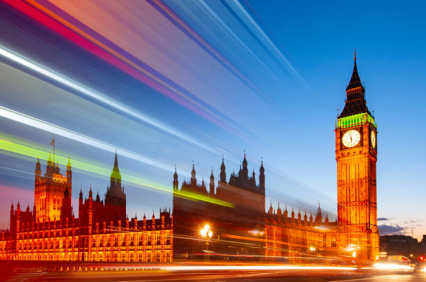 istock Big Ben Clock Tower with Blurred Traffic Light Trials, London, UK 1857431527