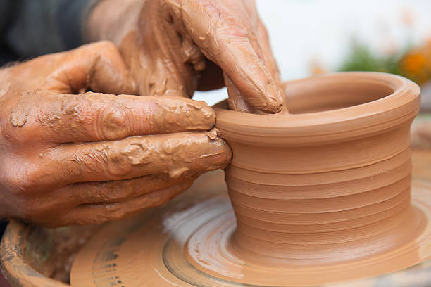 istock craftsman works in clay dishes 185744483