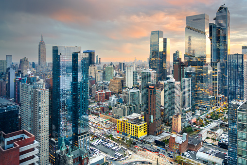 New York, New York, USA in the Midtown district of Manhattan at dusk.