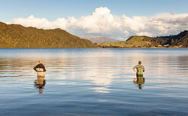 Two men fishing stock photo