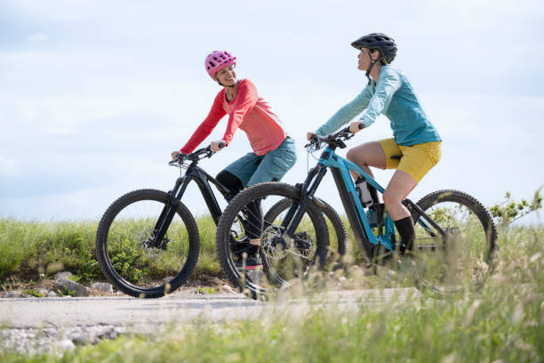 istock Women riding electric bicycles 1857446857