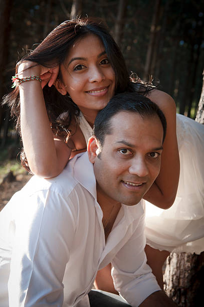 Portrait of young happy smiling indian couple stock photo