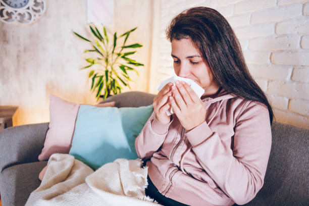 istock Sick woman sitting at home 1857471128