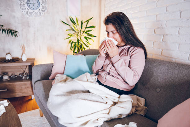 istock Sick woman sitting at home 1857471136