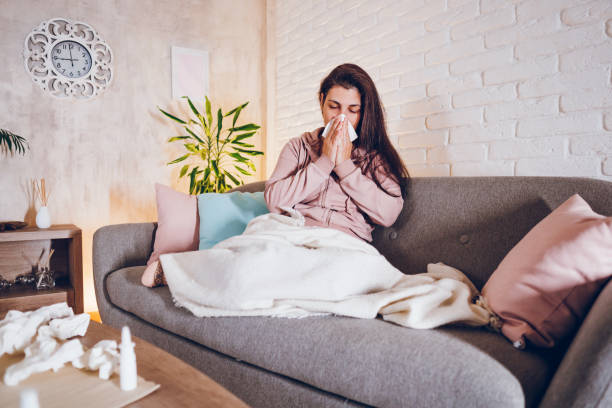 istock Sick woman sitting at home 1857473804
