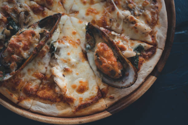 Delicious pizza topping with seafood. Top view