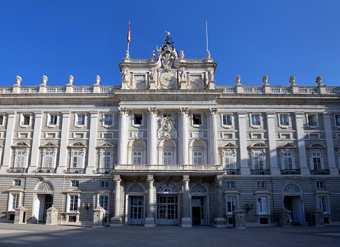 Madrid, Spain, October 5, 2023: View of the entrance to the Royal palace (El Palacio Real de Madrid) in the downtown of the Spain capital. It is the official residence of the Spanish royal family.