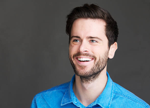istock Portrait of a cheerful young man laughing 185749376