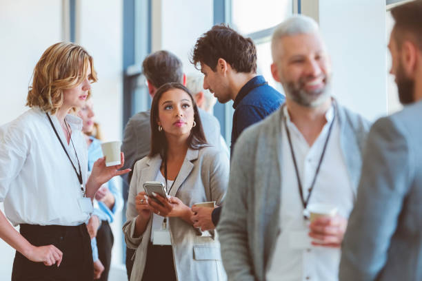 istock Business people in convention center during coffee break 1857500052