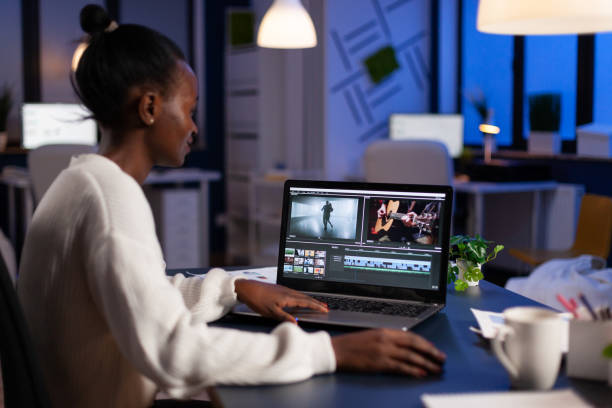 istock African american video editor working late at night at digital movie project 1857500571