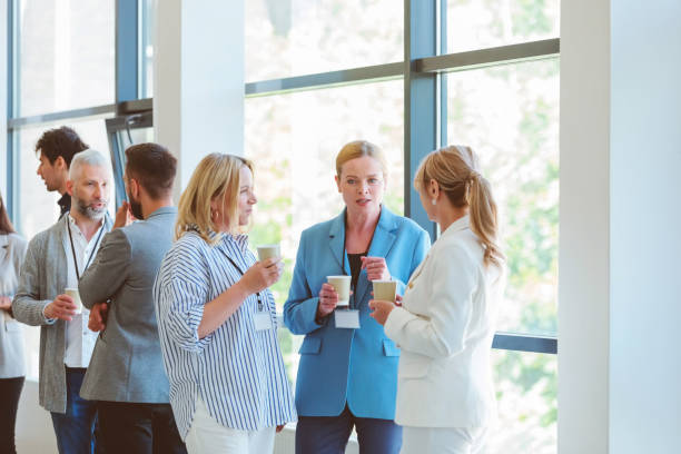 istock Business people in convention center during coffee break 1857501091