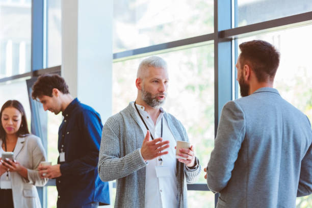 istock Business people in convention center during coffee break 1857504746