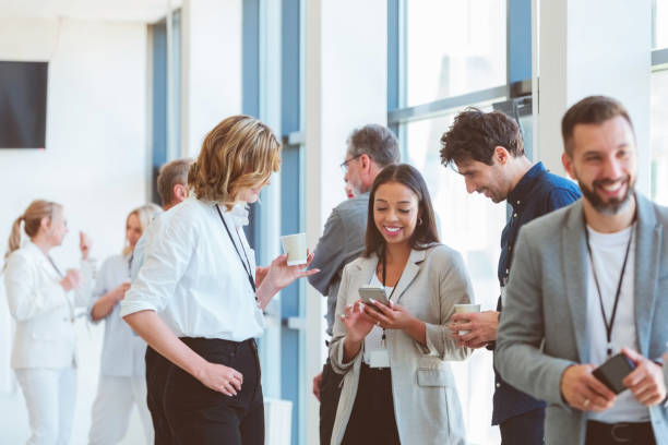 istock Business people in convention center during coffee break 1857505260