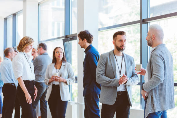 istock Business people in convention center during coffee break 1857505787