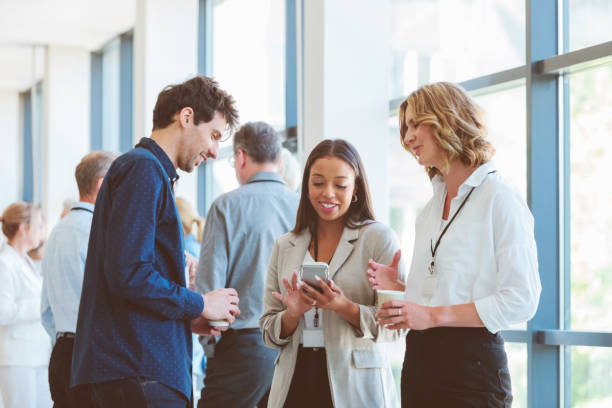 istock Business people in convention center during coffee break 1857506811